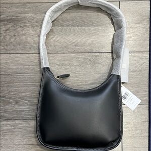 NWT COACH black Curved Zip Bag